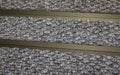 Close up image of Natural Beige Superguard inserts in Bronze ARCHIMAT aluminium architectural matting