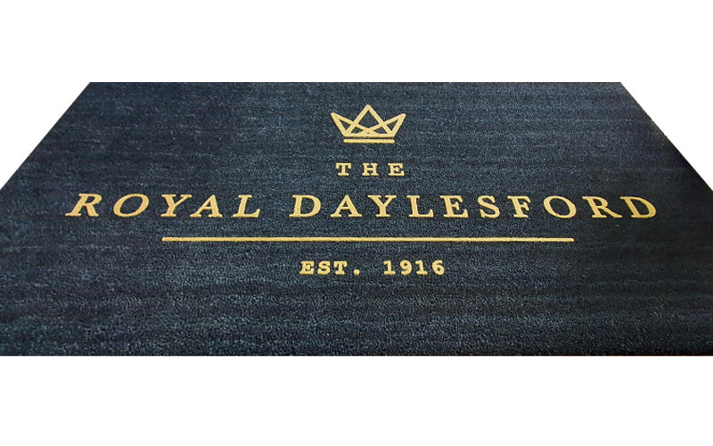 Product image of black Coir mat with gold embossed logo 