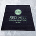 Full product image of black coir base with green embossed logo.