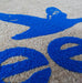 Close up image of grey coir with blue embossed logo.