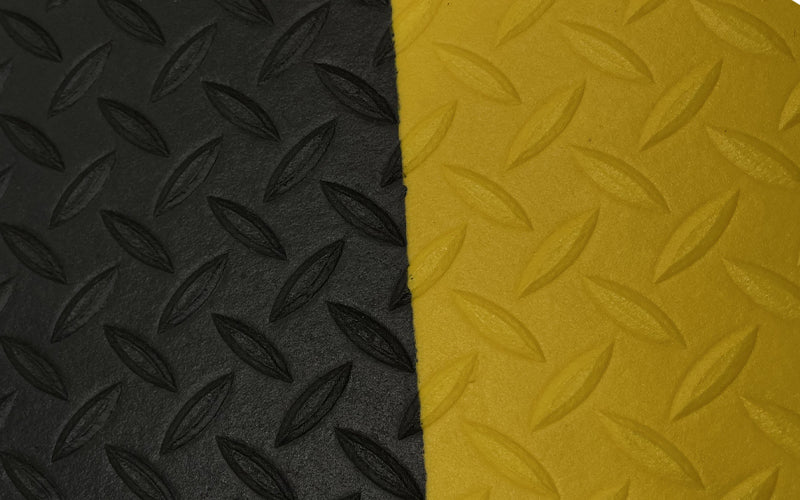 Close up mage of Anti-fatigue mat called Diamond Foam Mat in black with yellow safety edges