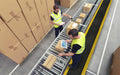Insitu image of Anti-fatigue mat called Diamond Foam Mat in black with yellow safety edges at an assembly production line