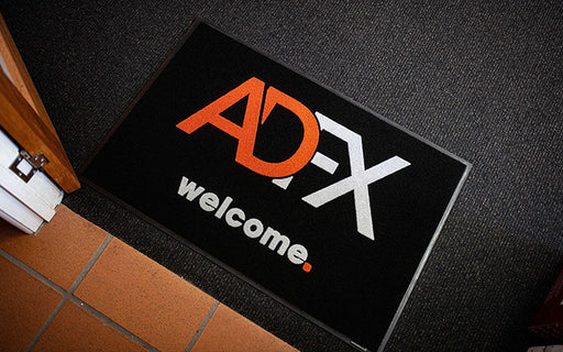 Insitu product image of black Dirtstopper Logo Mat with two colour print at office entrance