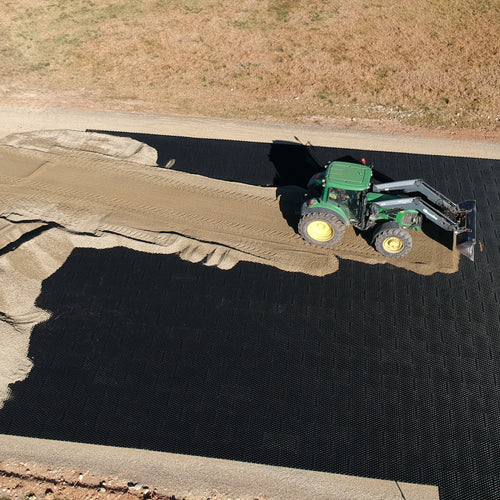 Insitu image of the ground stabilising pavers with a tractor driving over it