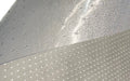 Close up product image of backing of vinyl Hoist Mat with its anti-slip underside anchors