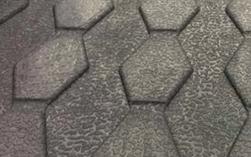 Close up product image of black, rubber Livestock Incline Mat