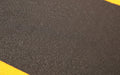 Close up image of the textured surface of the anti-fatigue safety cushion mat