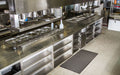 Insitu Product Image of black rubber Safewalk Standard Anti-fatigue mat in commercial kitchen