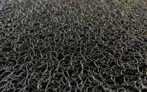 Close up image of the black spiralloop mat made of vinyl