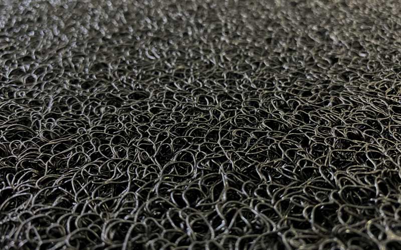 Close up image of the black spiralloop mat made of vinyl