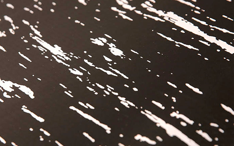 close up of the black with white pattern tile top premier mat.