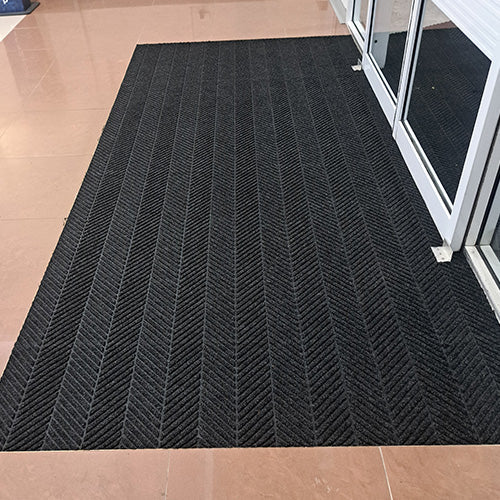 Product image of charcoal Waterhog Eco Elite Entrance Mat in a recess