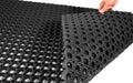Image of the front and back of the honeycomb heavy duty drainage mat with studs underneath to allow for easy drainagem.
