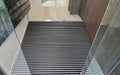 Insitu image of Aluminium Architectural Mat with Charcoal Superguard Inserts in residential building