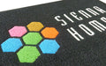 Close up of vinyl SpiralLoop Logo Mat for client