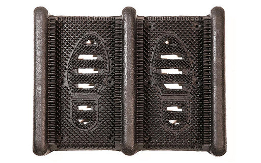 Full product image of black rubber Mud Chucker that scrapes mud off shoes
