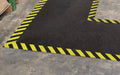 Insitu product image of non-slip, black and yellow Smartgrip Industrial matting Roll used in warehouse as a path