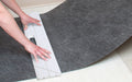 Insitu picture of the SmartGrip Safey Knife and Cutting tool being used to measure the Smart Grip Mat.