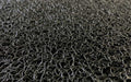 Close up product image of black Spiral Loop Mat made of Vinyl with PVC Backing